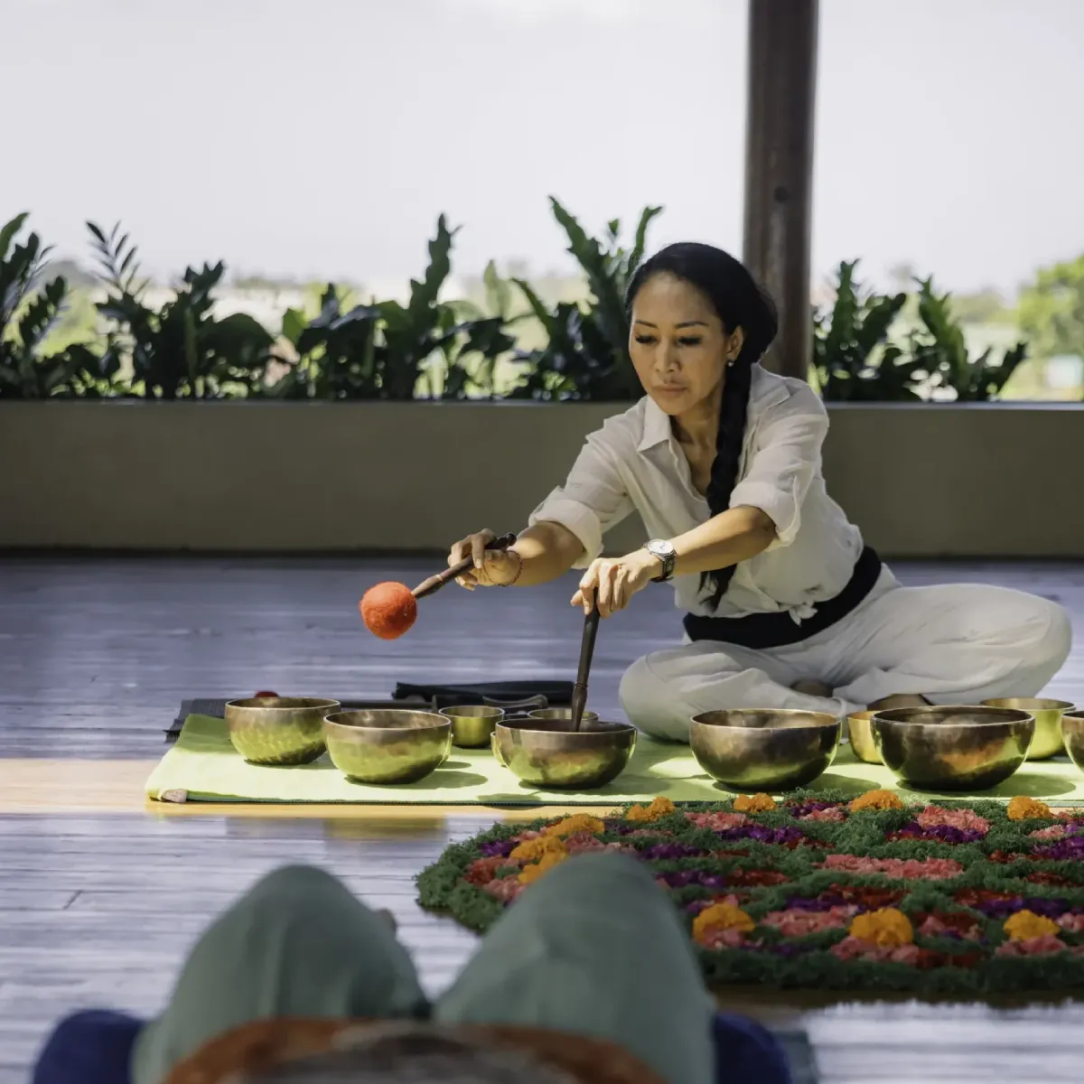 Sound healing session with Tibetan bowls performed by a practitioner