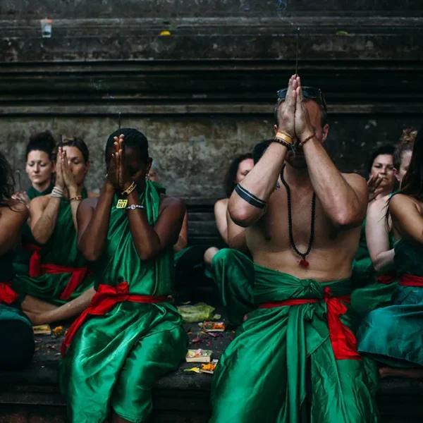 Group of people doing spiritual activity with Balinese clothing