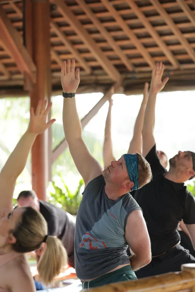 Point of view of a person gracefully performing yoga poses during a class