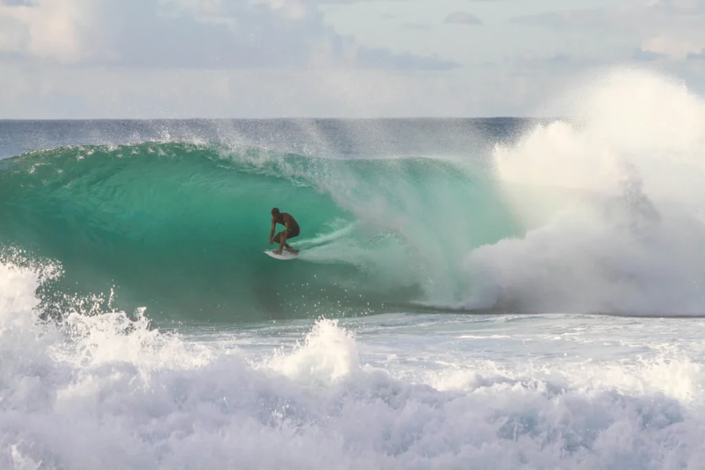 Surfer with big wave in Bali