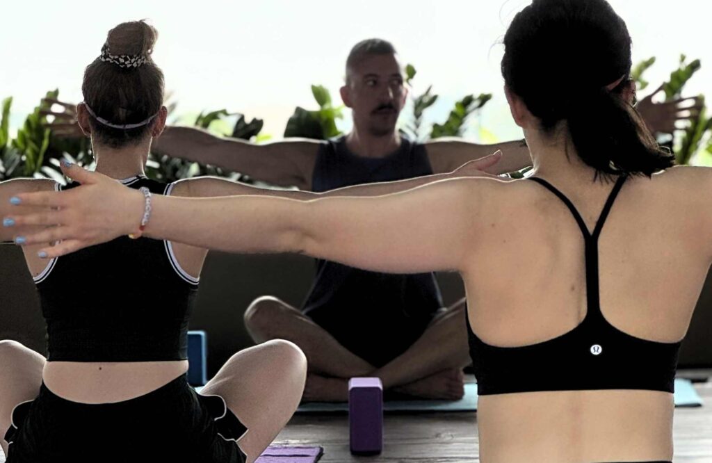 yoga instructor with participants