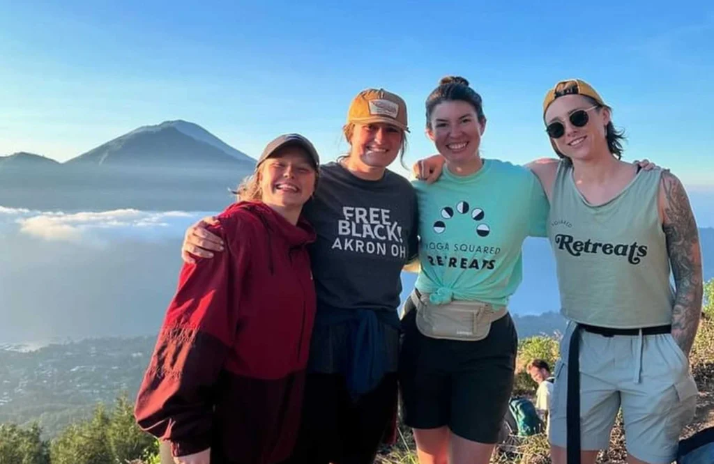 group of girls on trip with a mountain background