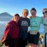 group of girls on trip with a mountain background